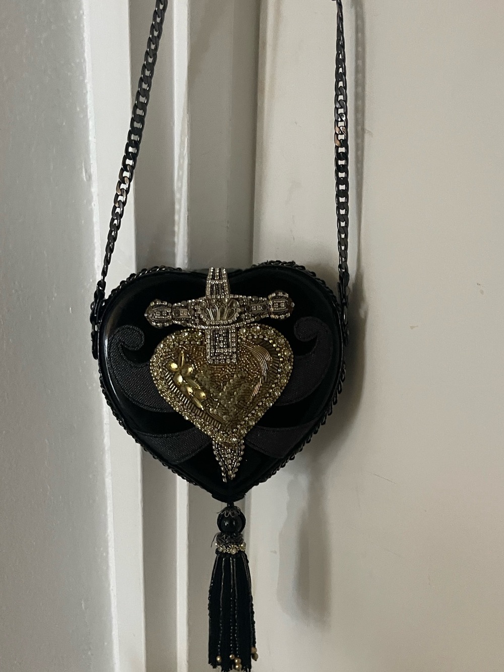 Mary Frances Black Heart Crossbody with Gold Embellished Crest and Tassel